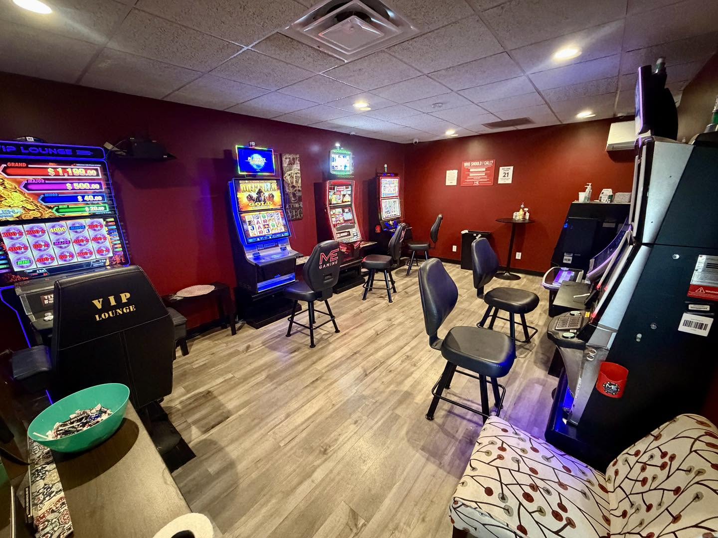 Video gaming room at Angelo's Express in Taylorville with gaming machines, padded chairs and new wood-look flooring